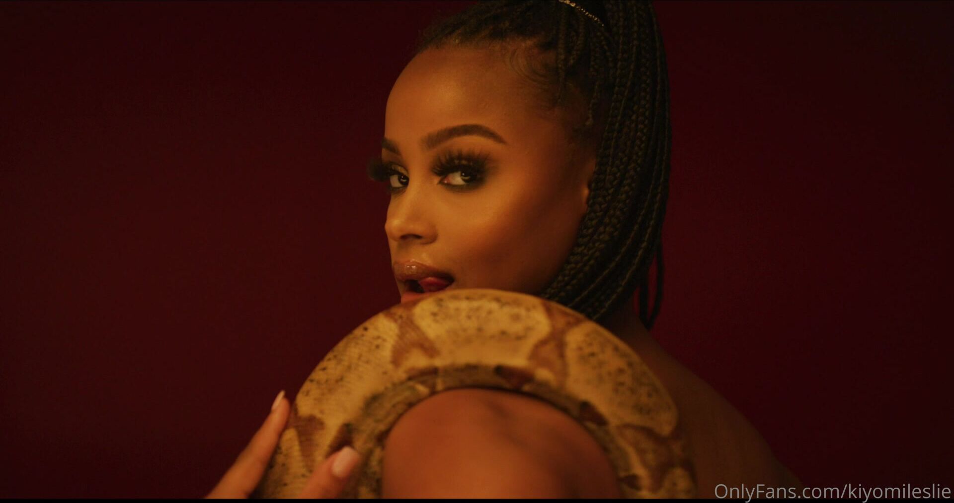 Kiyomileslie Poses Seductively With A Snake